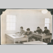 Four men sitting at desks studying (ddr-ajah-2-426)