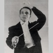 Conductor wearing tuxedo and posing with wand (ddr-njpa-2-424)