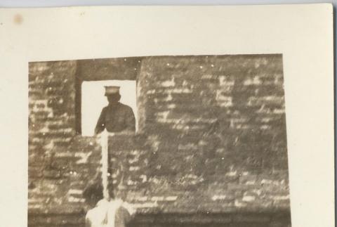 A man climbing down from a window (ddr-njpa-6-16)