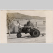 Girl on tractor (ddr-densho-426-55)