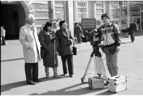 Harry Fukuhara, Loni Ding, one other, and cameraman (ddr-densho-1007-1178)