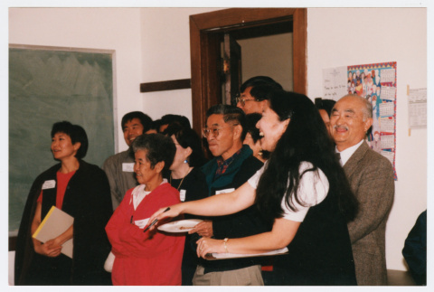 Attendees and staff laughing at Japanese Language School Reunion (ddr-densho-506-125)