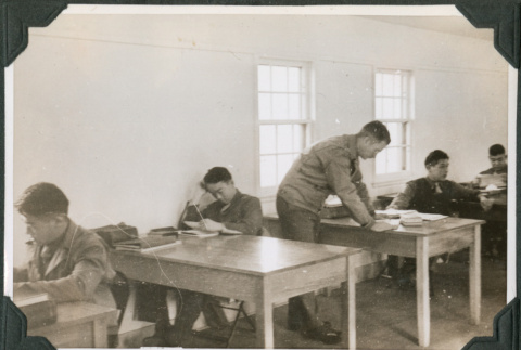Men studying at desks (ddr-ajah-2-428)