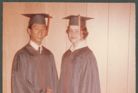 Couple in graduation robes (ddr-densho-523-390)