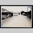 Two buildings on a dirt road. (ddr-densho-404-178)