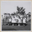 Large group of men, women and children in yard outside house (ddr-densho-522-56)