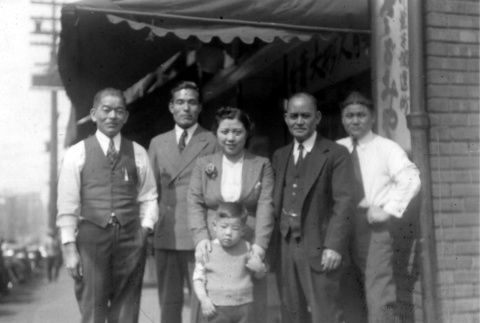 Family in front of their store (ddr-densho-13-39)