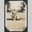 woman sitting on bench (ddr-densho-378-551)