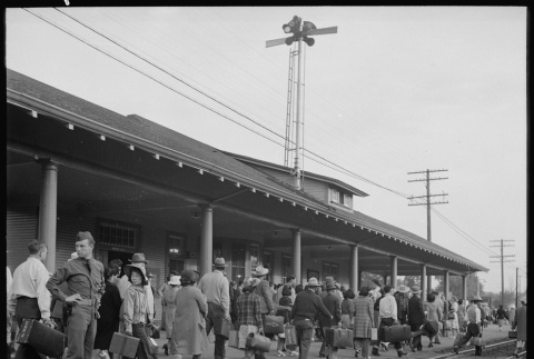 Japanese Americans waiting for train (ddr-densho-151-290)