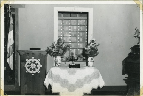Altar with offerings at the Manzanar Buddhist Church (ddr-manz-4-200)