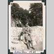 Woman and baby sitting on stone steps (ddr-densho-483-645)