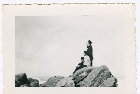 Three People on Rocks overlooking Ocean (ddr-densho-368-720)