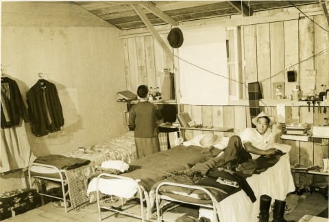 Family inside of their Assembly Center barracks (ddr-densho-22-448)