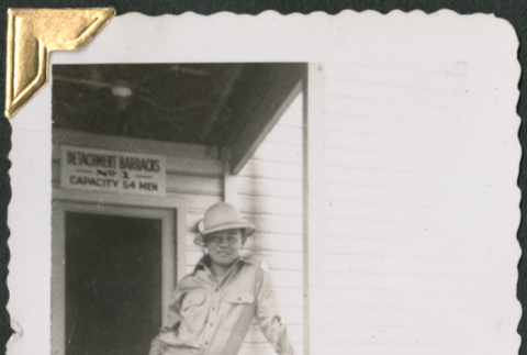 Man standing at entrance to building (ddr-densho-434-373)