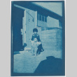 Two children outside barracks (ddr-densho-329-1282)