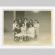 Nisei female students with a teacher in front of barrack (ddr-csujad-44-39)