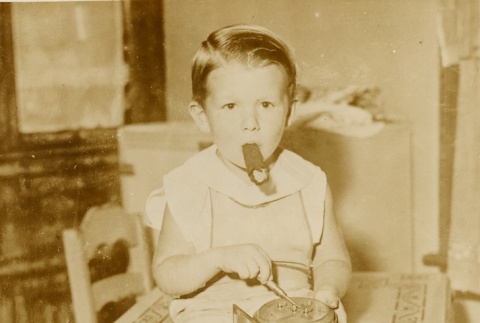 Mickey Norman sitting on a table (ddr-njpa-1-993)