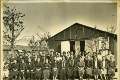 Group photograph outside the Manzanar Buddhist Church (ddr-manz-4-18)