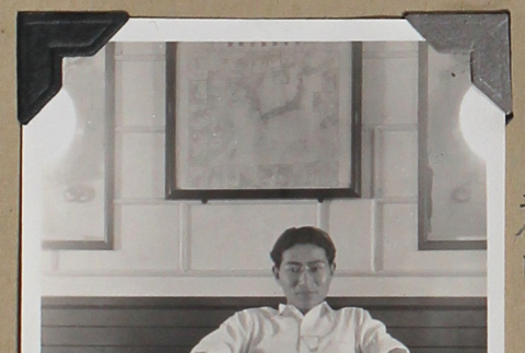 Tokeo Tagami reclines on a bench (ddr-densho-404-257)