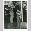 Staff Sergeant Charles F. Lewis lowers flag of the United Kingdom at the closing of Camp Ebisu (ddr-densho-1007-124)