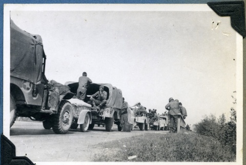 Military battalion taking a break on the Autobahn (ddr-densho-22-40)