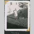 Man wearing mops as skirt and wig (ddr-densho-434-186)