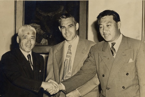 Wilfred C. Tsukiyama posing with two men (ddr-njpa-2-878)
