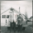 Two Sakura brothers in front of car (ddr-densho-523-263)
