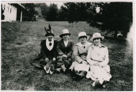 Four women sitting on a lawn (ddr-densho-353-415)