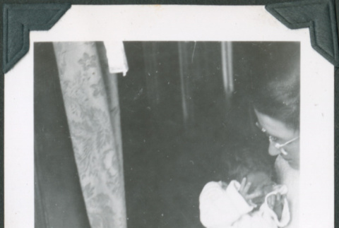 Photo of a woman holding a baby (ddr-densho-483-1288)