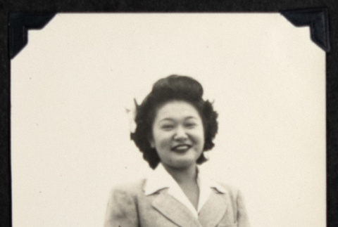 Smiling woman with a handbag (ddr-densho-542-751)