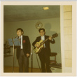 Two men standing at microphone (ddr-densho-426-168)