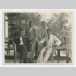 Group photograh of men on hotel porch (ddr-densho-335-265)