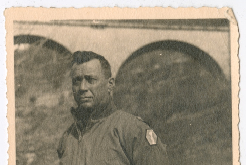Person standing beside 442nd Infantry Regiment plaque (ddr-densho-1007-17)
