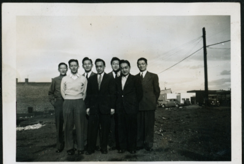 Group of men in an empty lot (ddr-densho-395-89)