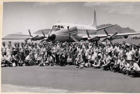 Large group around airplane on tarmac (ddr-densho-466-424)