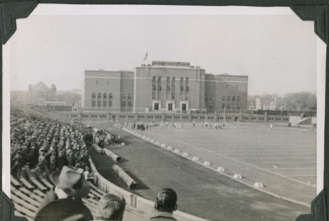 Football game in stadium with crowd in bleachers (ddr-ajah-2-516)