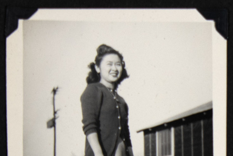Smiling woman in a cardigan (ddr-densho-542-714)