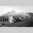 Family in front of greenhouse (ddr-densho-134-14)