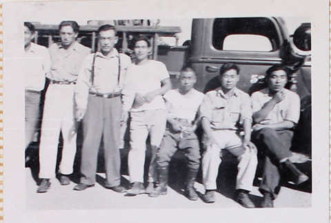 Seven men by fire truck (ddr-densho-464-17)