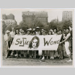 Cast of The World of Suzie Wong holding Suzie Wong Banner in park (ddr-densho-367-217)