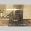 A man kneeling at a table (ddr-njpa-4-2715)