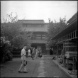 Group standing in courtyard outside workshop (ddr-densho-426-2477)