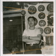 Takeo Isoshima in front of ship dials (ddr-densho-477-234)