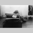 [Girl resting in Children's Village barrack] (ddr-csujad-29-319)
