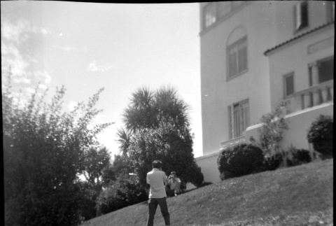 Two men on lawn of house on 36th and Shoreview (ddr-densho-426-909)