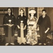 Hiroko Kawasaki posing in wedding clothes with her husband, Kan Kikuchi and another man (ddr-njpa-4-575)