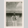 Man standing outside barracks (ddr-densho-329-1364)
