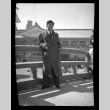 Man in coat in front of Japanese building at Golden Gate International Exposition (ddr-densho-475-126)