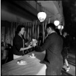 Woman serving man a sandwich (ddr-densho-426-1690)